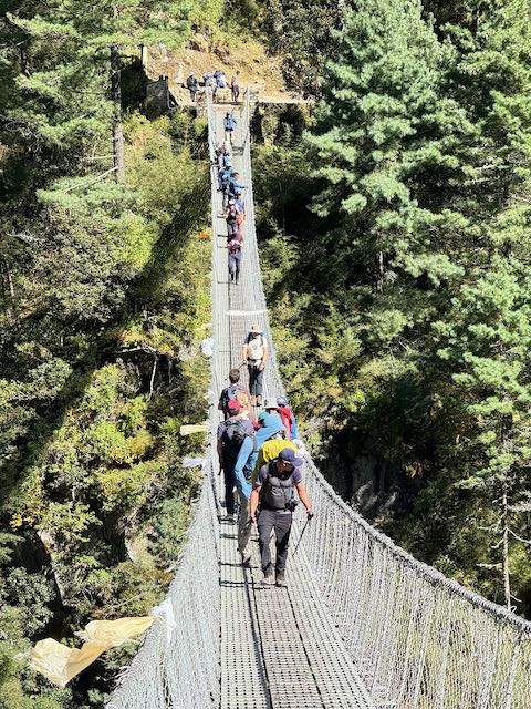 Crossing the Hilary Bridge below Namche Bazaar