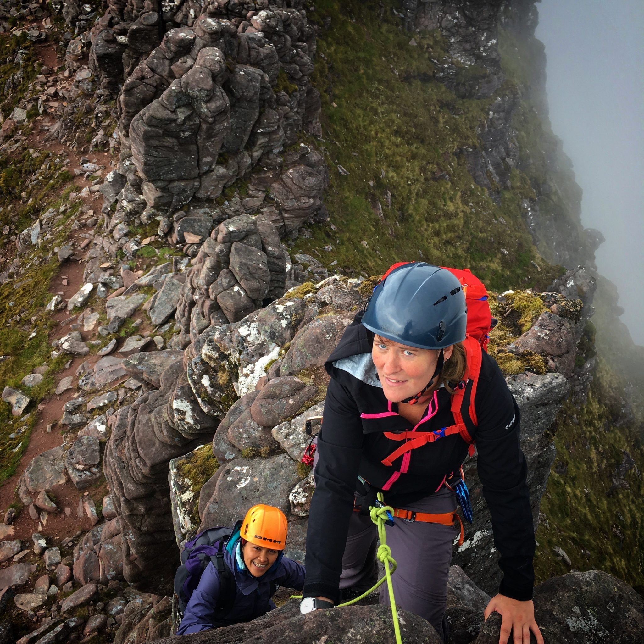 Scramblers traversing the Corrag Bhuidhe pinnacles on An Teallach during a mountaineering course