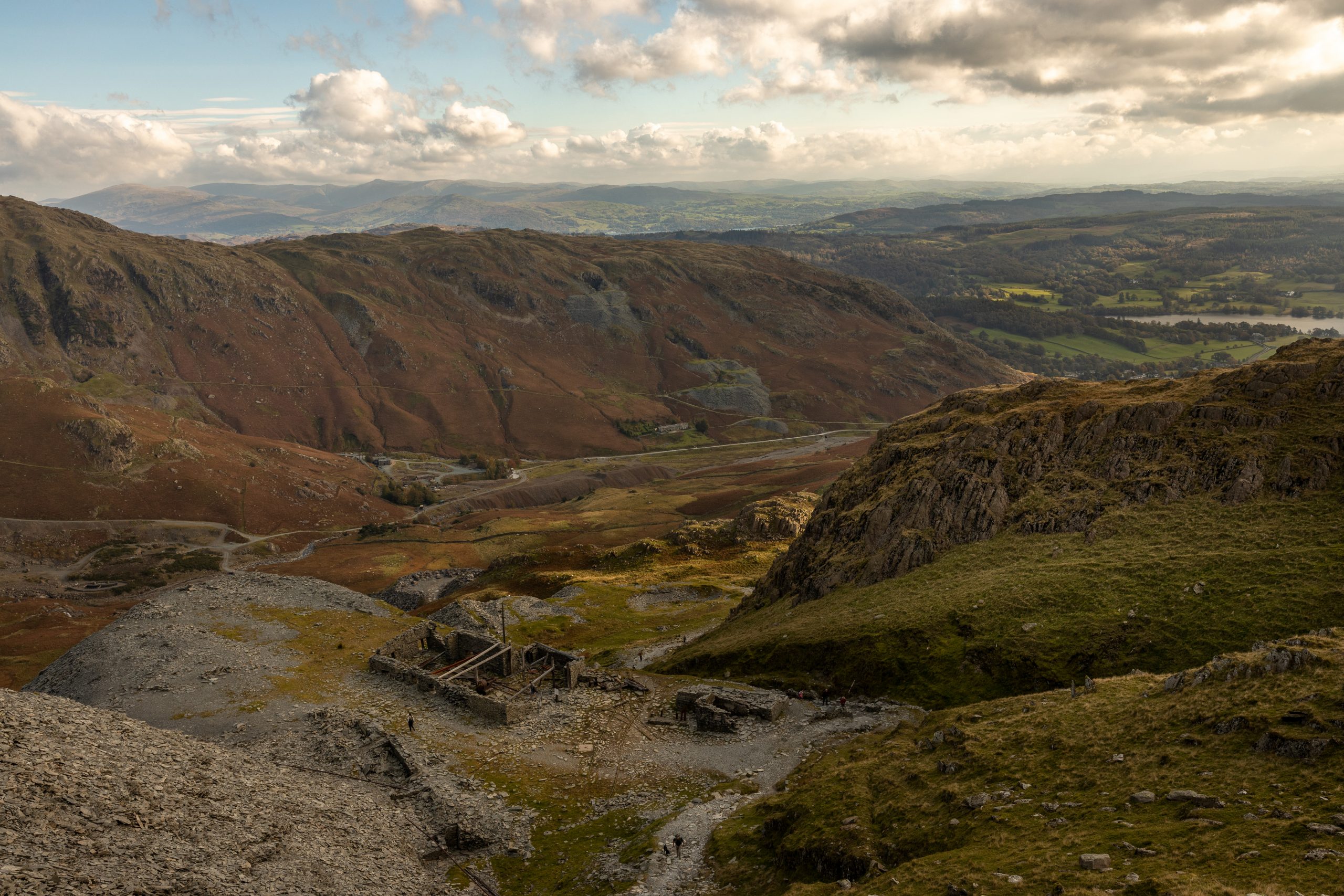 A view of the old mining buildings and the Coppermines Valley during a guided walk up the Old Man of Coniston in the Lake District