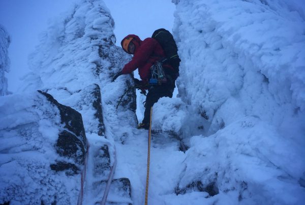 A climber leads the way up through the "fingers" of Fingers Ridge in the Cairngorms