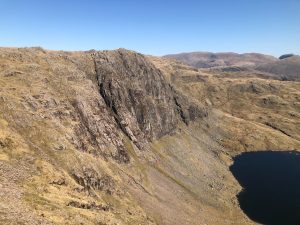 The cliffs of Pavey Ark and the line of Jack's Rake towering above Stickle Tarn