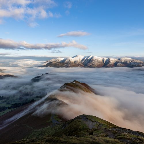 Skiddaw viewed from Catbells looking over a sea of low clouds - a typical view on guided winter walk or winter skill course in the Lake District