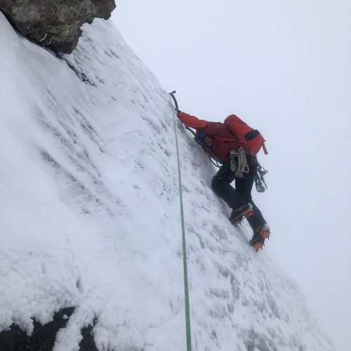 A climber balances on his front points while climbing The Curtain on Ben Nevis - typical of our winter climbing courses in the Cairngorms, Glencoe and Ben Nevis