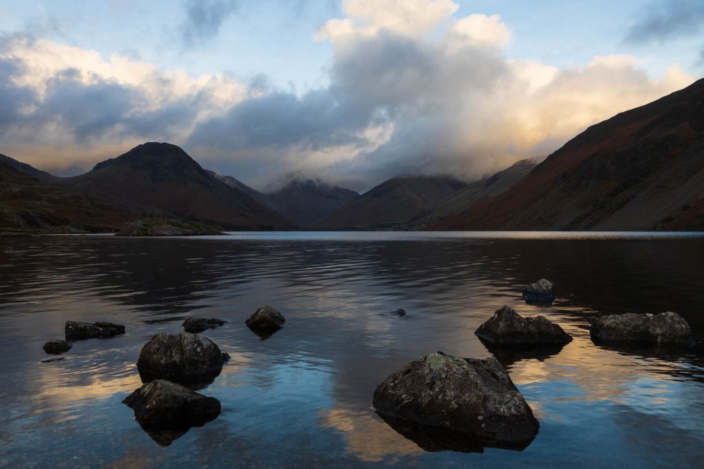 Wastwater seen after a storm, with Great Gable and Scafell Pike emerging through the clouds